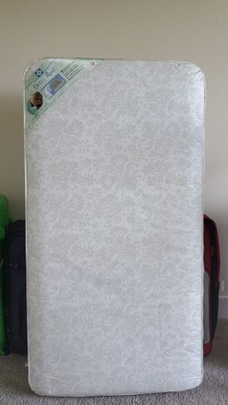 Brand new Sealy Ortho Rest crib and toddler mattress