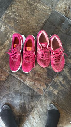 2 pairs of almost new pink Nike shoes