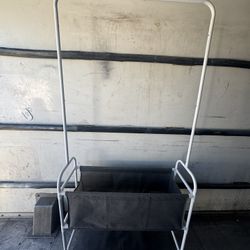 White metal storage rack with fabric shelves