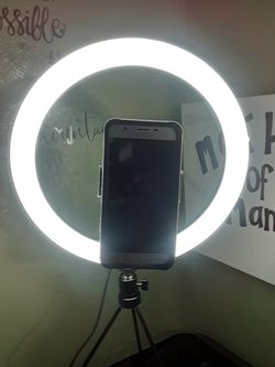 Ring light! It holds phone or Camera for videos, make up.