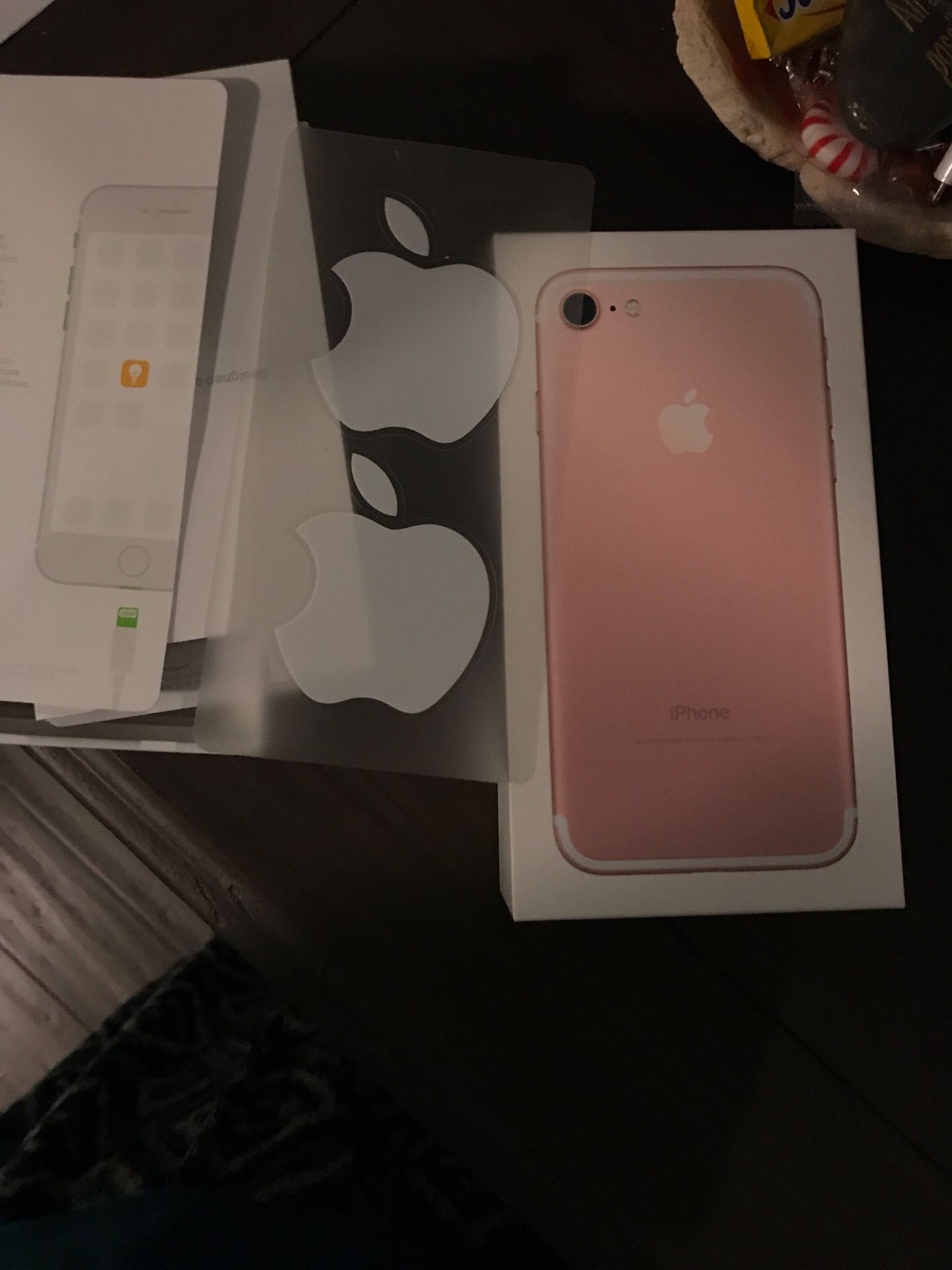 Empty iPhone pink box with Apple stickers