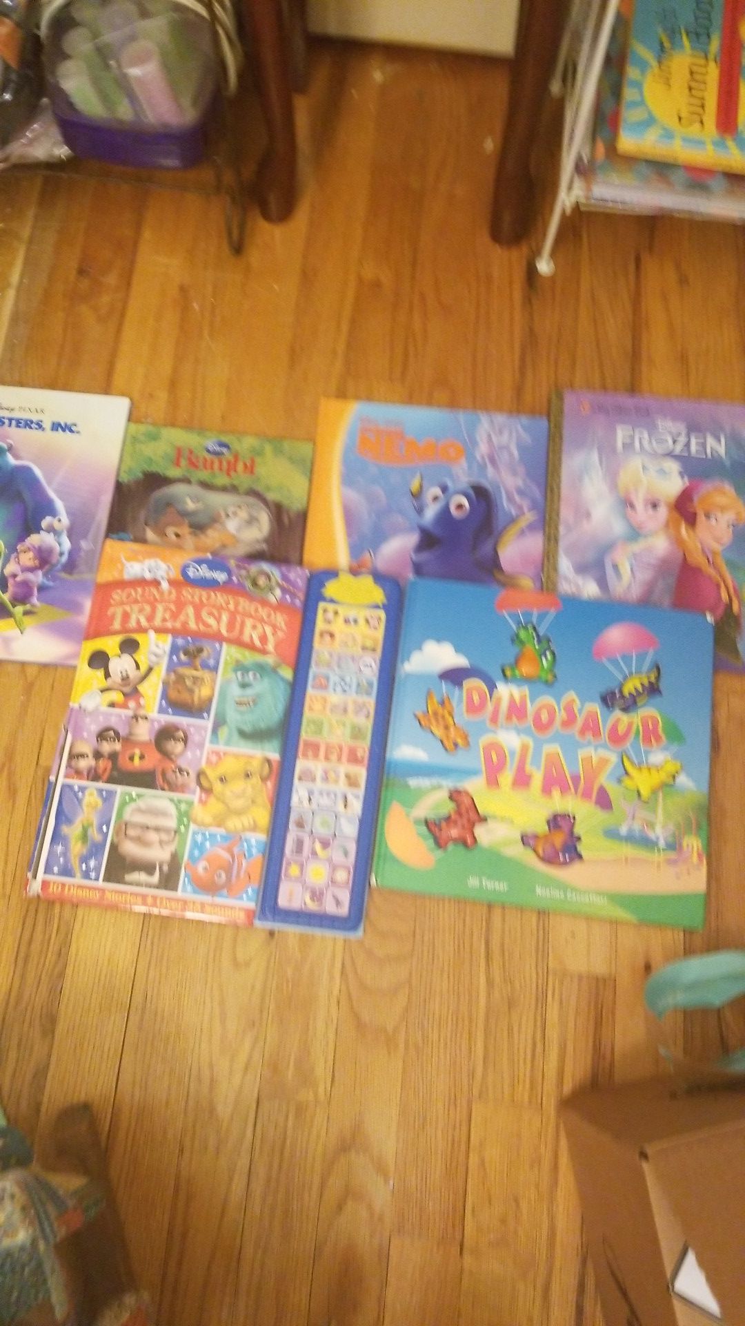 Frozen book, finding Nemo book , a bambi book, monsters inc book, and other