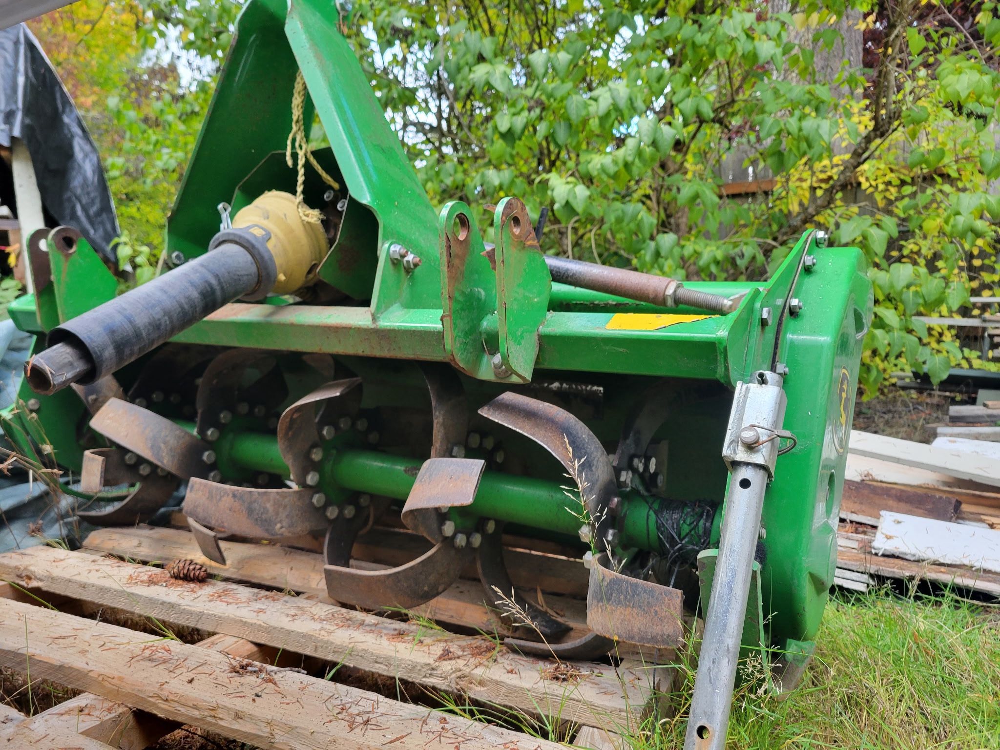 John Deere 1023E Tractor With Rototiller And Forklift