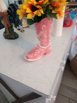 Cowgirl vase with flowers