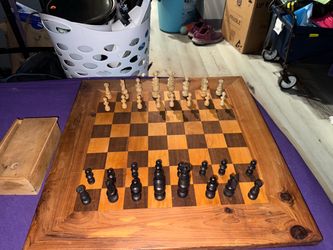 Handmade wooden chessboard and wooden pieces