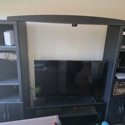 Entertainment Center With Shelf Towers And TV Stand. 