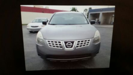 Nissan rogue 2009 con 1500 de initial