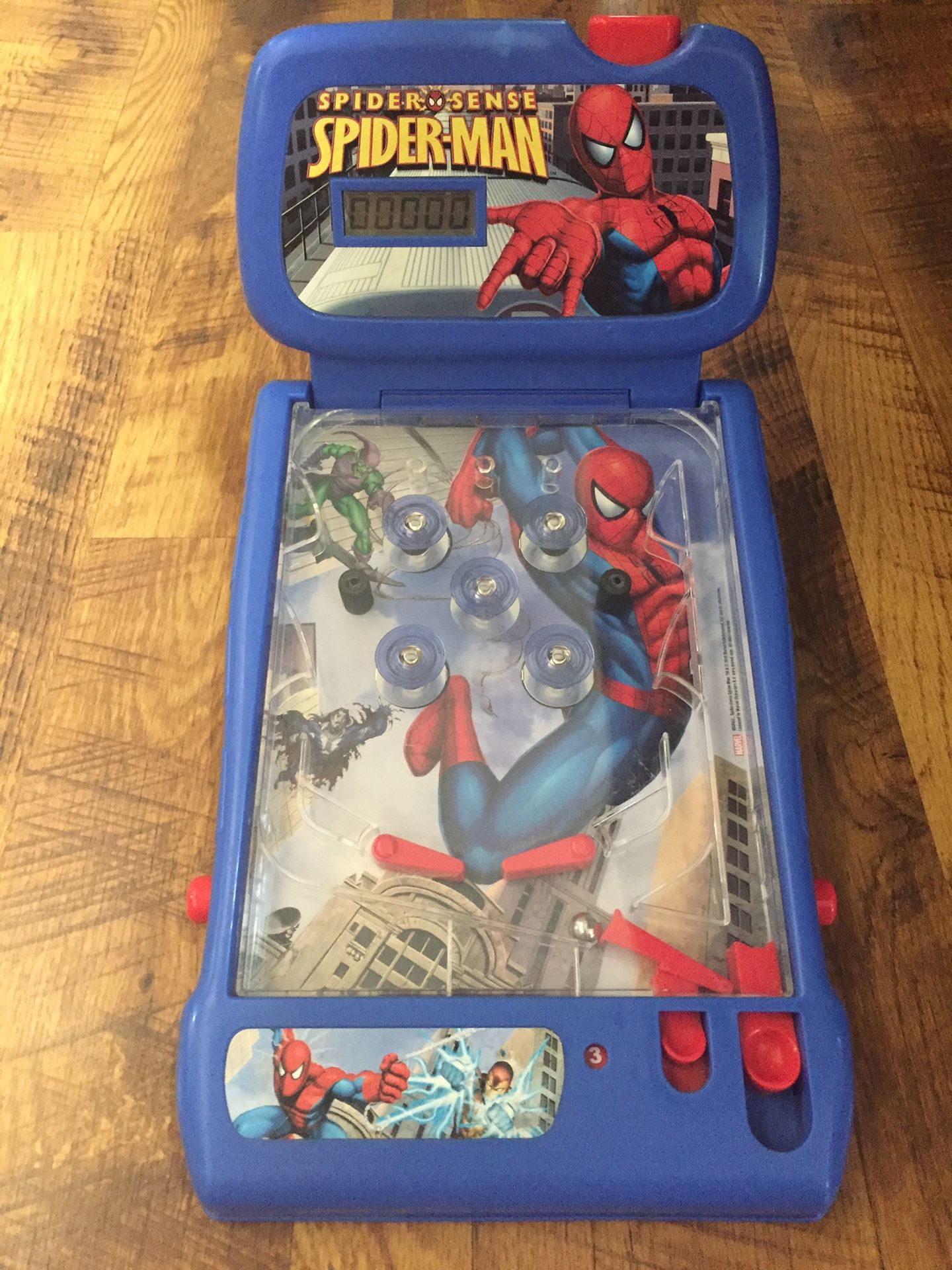 Spider-Man table top electronic (lights and sounds) pinball game for kids.