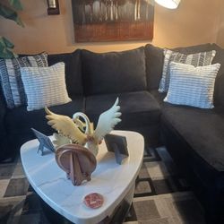 Two Piece Sectional The Coffee Table And End Table And The Rug It's In Perfect Condition