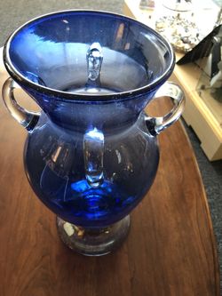 Gorgeous flower vase with 4 handles.