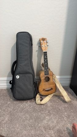 Ukulele, neck strap, and case - Sound Smith