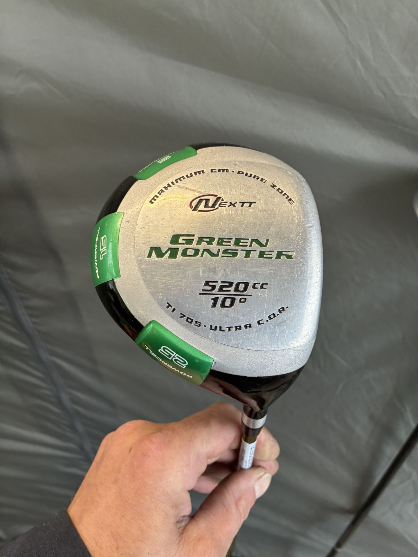 This is a Nextt Green Monster 520cc golf club driver.  
