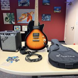 Very Nice Les Paul Style Electric Guitar, Fender Amp, Cord, Bag, Strap, Stand, And Pics