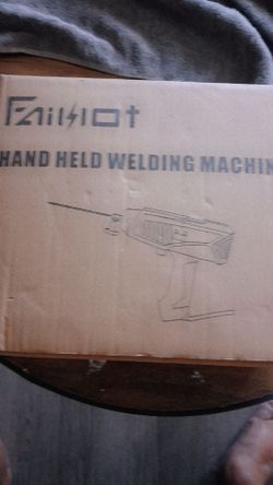 Hand held welding machine