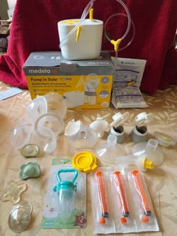 Medela breastfeeding pump, colostrum collecting syringe, silverette