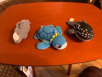 3 stuffed animals turtle, whale, rhino