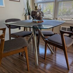Modern Glass Table With Mid Century Chairs