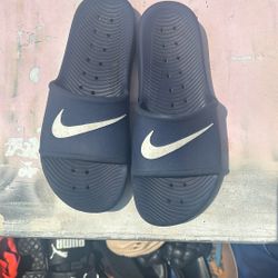 Blue Nike slides nine men