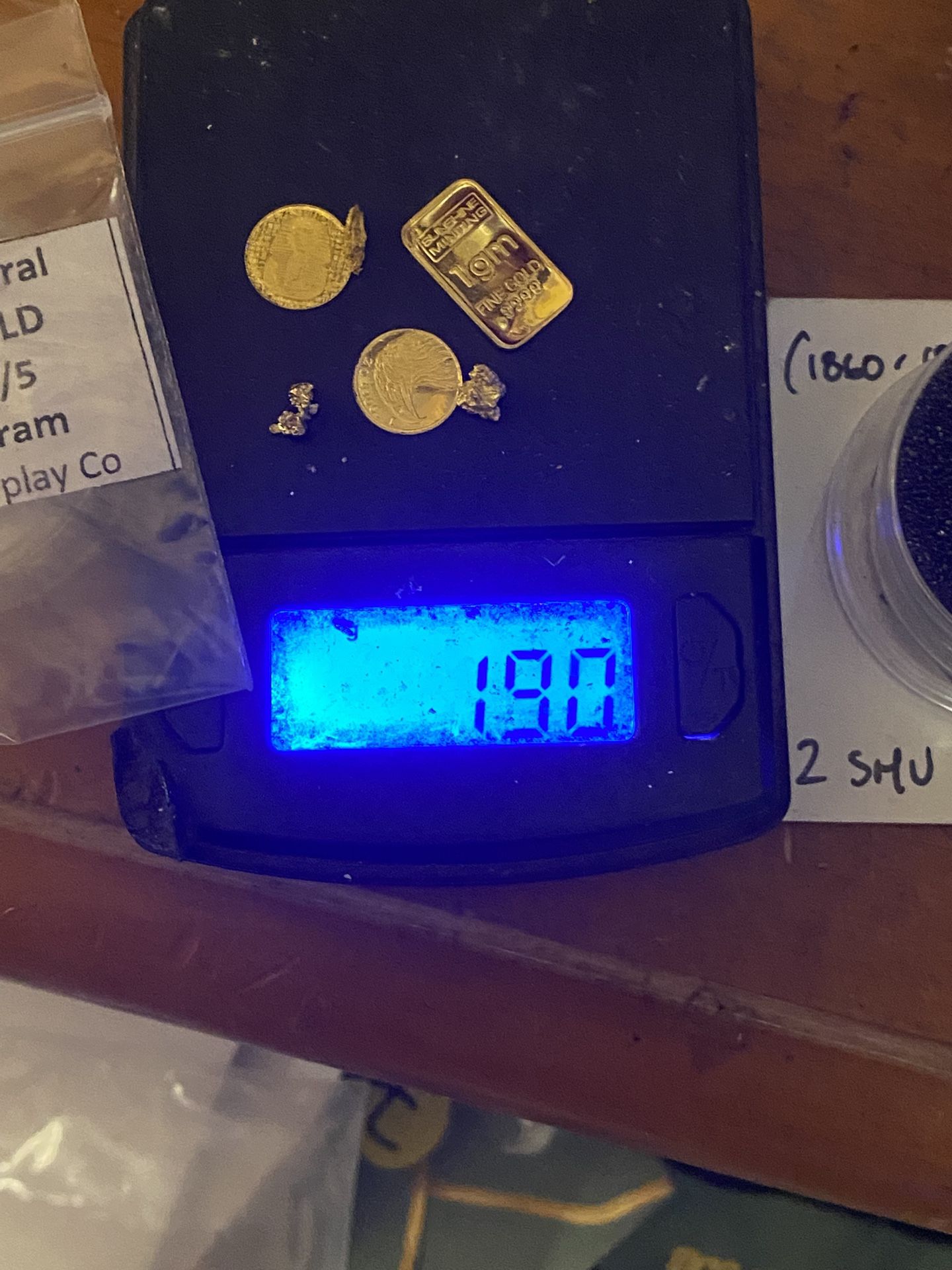 A little over 2 g of pure gold bar and rounds and nuggets
