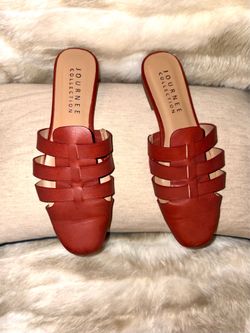 These mule-style sandals, the Jazybell model from Journee Collection, are distinguished by their interwoven strap design and square toe. They feature 