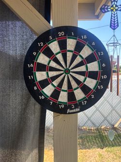 Hanging dart board with darts