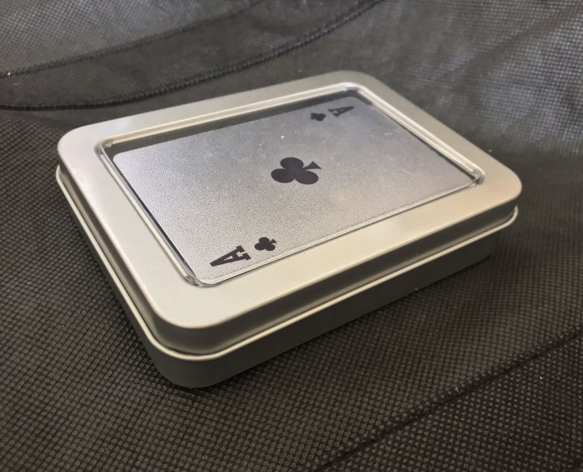 silver colored playing cards with $ theme