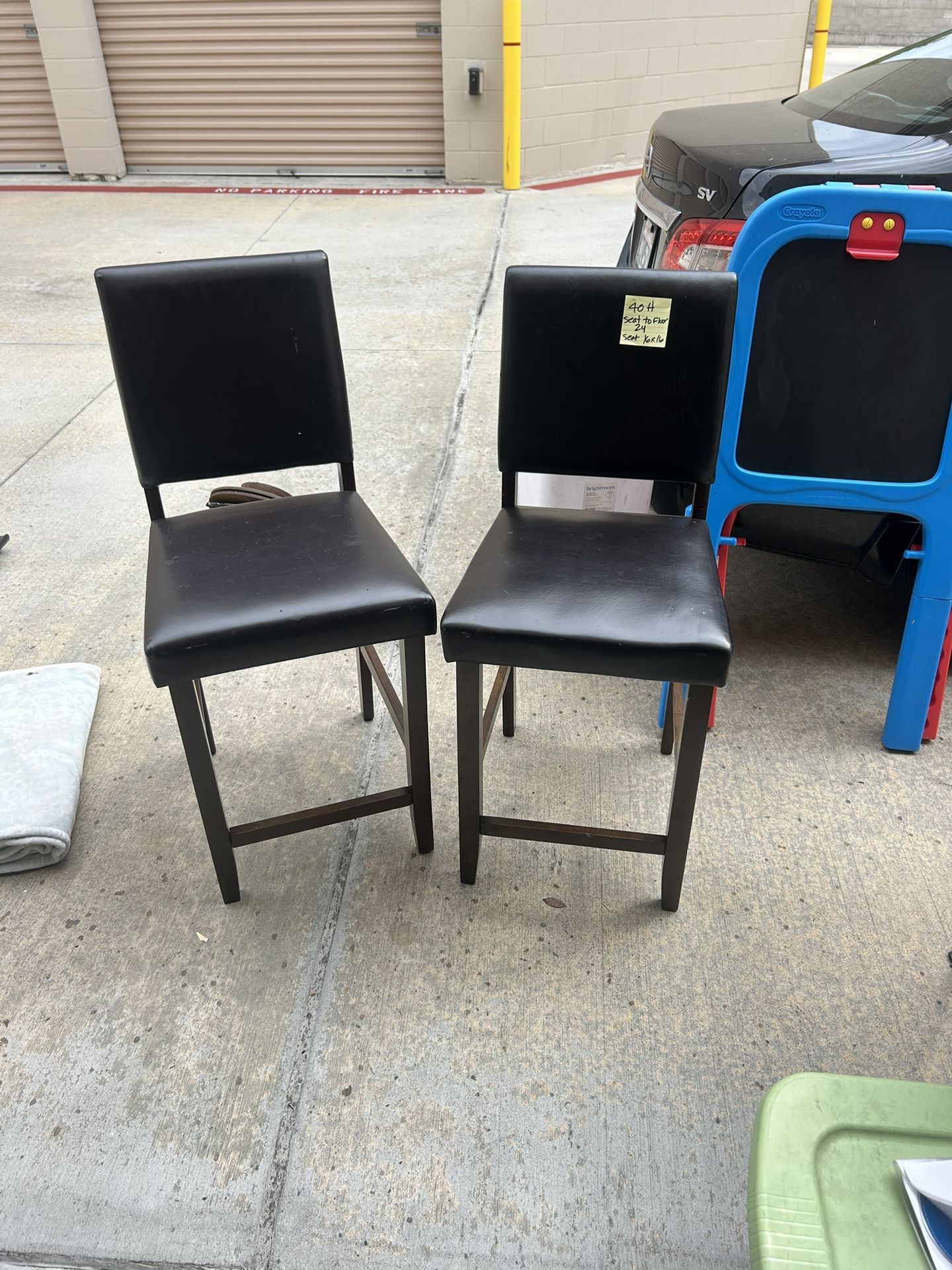 2 brown chairs 40”h. Seat to foior 24” seat approx 16x16