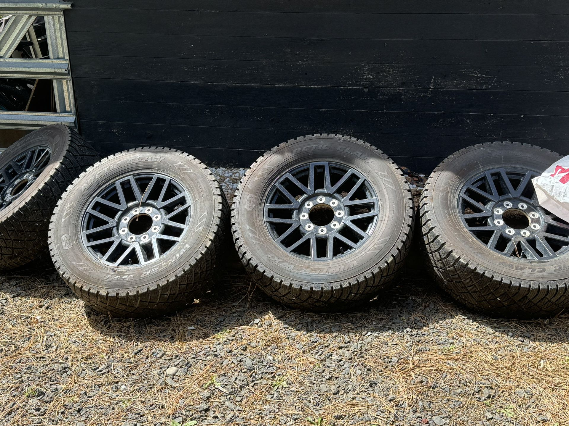 Stock Ford Superduty OEM black rims with tires