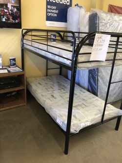 Bunk bed with mattresses