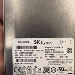 The SK hynix 1TB SSD (Model: HFS001T32TNF-N2A0A BB, DP/N: 048FH9) shown in the image is a solid-state drive that can be found for sale through various