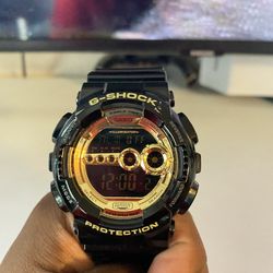 Black and gold g shock
