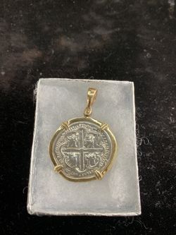 Atocha silver coin pendant in gold bezel