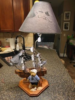 Ship Table Lamp - vintage nautical-themed table lamp featuring a wooden model sailing ship mounted on an octagonal wooden base alongside a dressed sa