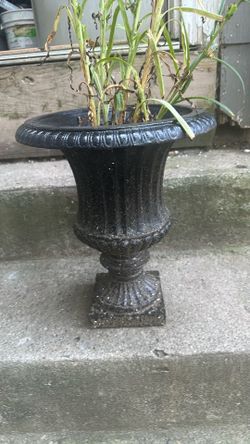 1 cast iron urn, 14 inches, in good condition. $60.00.