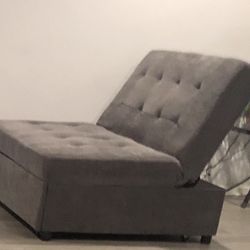 Gray Small Two Seater Couch That Turns To A Bed. 