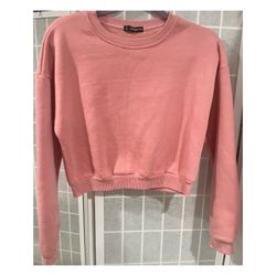 Shein Pink cropped crewneck sweatshirt long sleeves with ribbed cuffs and hem. Small Medium One size. Good condition, never worn. See all images.