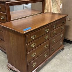 Wooden dresser from the Ethan Allen brand.
