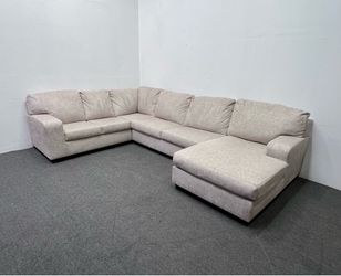 Ashley Light Beige Sectional with right facing Chaise. We deliver & setup.