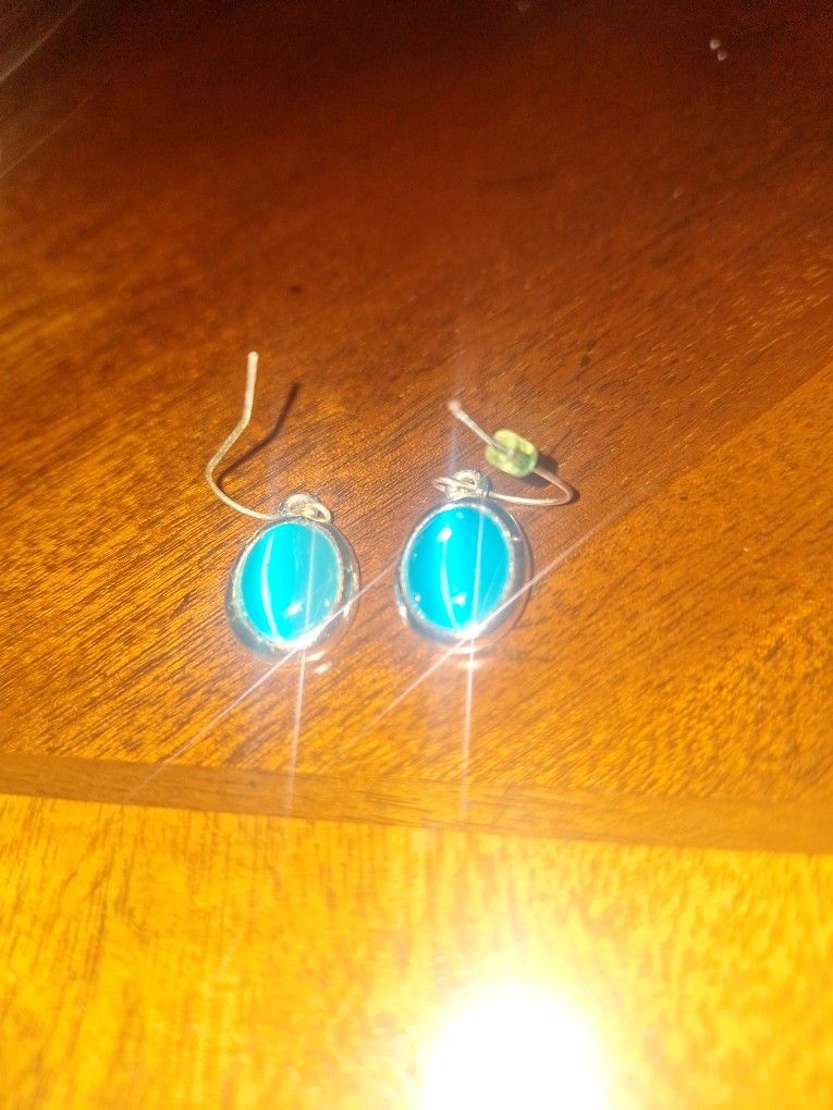 vintage blue cat's eye pendant in a sterling silver setting.