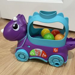 Fisher-Price Poppin’ Triceratops Dinosaur Interactive Musical Learning Toy with 4 balls