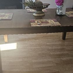 Wooden table for 4 chairs and can be made larger for 8 chairs