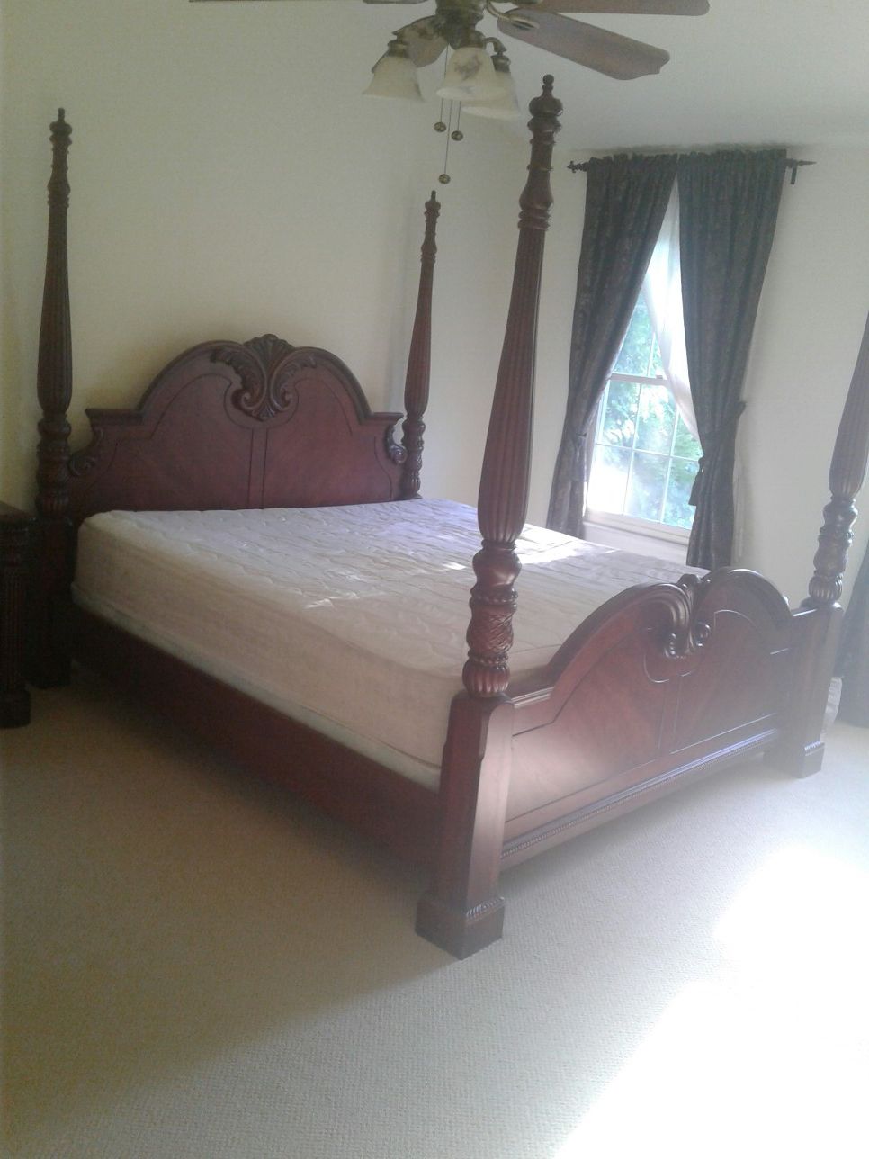 King size bed with dresser and nightstand and clock stand