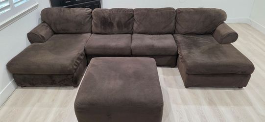 Ashley Furniture Brown U-Shaped Sectional Sofa with Ottoman