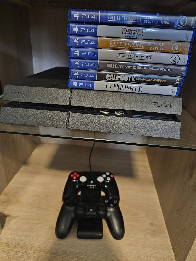 Playstation 4 With Games And Controllers