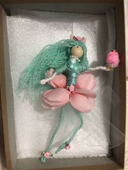 Flower doll with pink chick