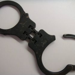 Peerless Hinged Black Hand Cuffs from the 50's