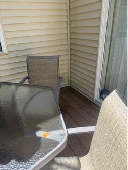 Glass patio table and 6 chairs