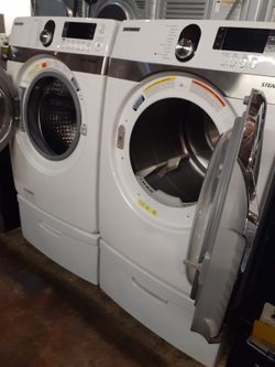 Samsung front load washer and dryer set with pedestal working perfectly with 4 months warranty