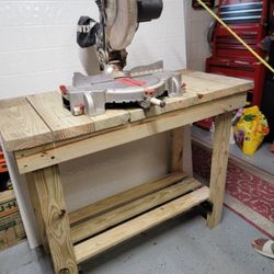 man 15 Amp Corded 12 in. Dual Bevel Miter Saw with LED Cutline Indicator. Work table included.
