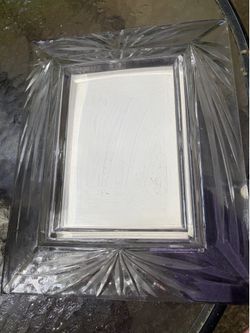 Beautiful cut glass frame.   Heavy.